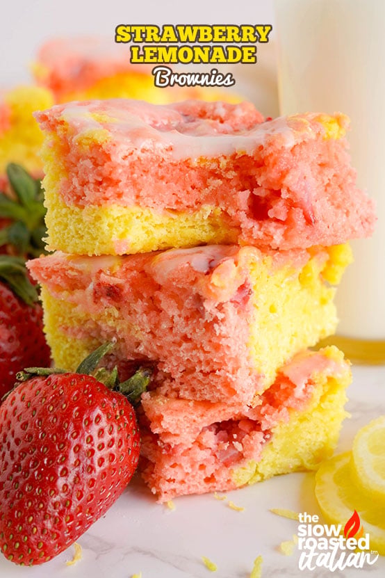 Strawberry brownies with a pink and yellow lemonade swirl and white lemon glaze, cut into squares