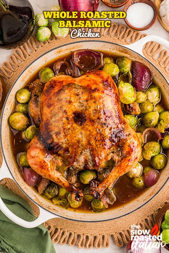 Roast chicken recipe with golden crackling skin, carved on a platter with Brussels sprouts and red onions