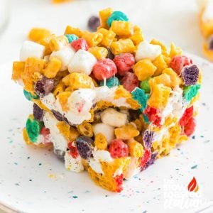 Close-up of a Cap’n Crunch cereal bar on a plate, showing colorful cereal and marshmallows throughout