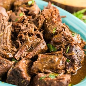 Crockpot roast with gravy on a plate
