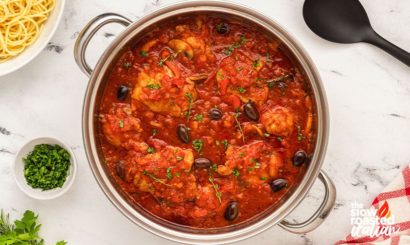 Process, sauce: browned chicken nestled skin side up in fire-roasted tomato sauce with fresh rosemary and thyme